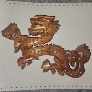 Solid wood, free standing dragon. Approx. 5×7×1 inch thick.